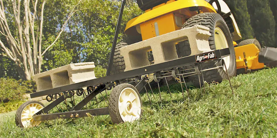 Dethatch compacted grass clippings